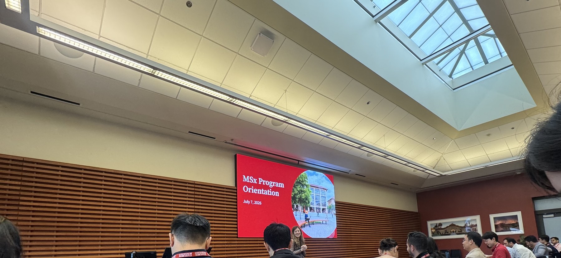 A Stanford GSB classroom during MSx Program Orientation, with the orientation slide at the front of the room.